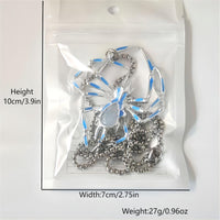 The Widow's Web Necklace packaging with size and weight details